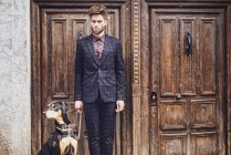 Fashion man with dog — Stock Photo