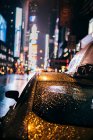 Taxi riding through night city — Stock Photo