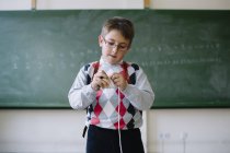 Boy with toy in classroom — Stock Photo