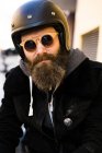 Bearded biker wearing sunglasses — Stock Photo