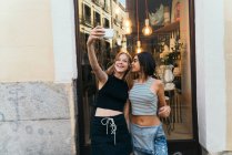 Young girlfriends taking selfie — Stock Photo
