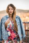 Young female posing in jeans jacket — Stock Photo