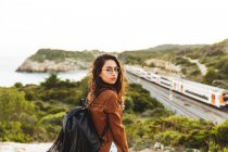 Girl looking over shoulder at camera — Stock Photo