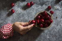 Cherry berries on stone table — Stock Photo