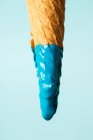 Waffle cone in blue paint — Stock Photo