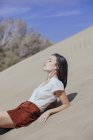 Stylish girl posing on sands — Stock Photo
