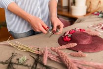 Crop person working in craft shop — Stock Photo