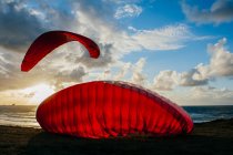 Parachutes landing near ocean — Stock Photo