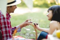 Couple toasting with red wine — Stock Photo