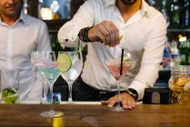 Barmen making cocktails — Stock Photo
