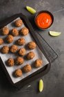 Homemade meatballs in oven tray — Stock Photo