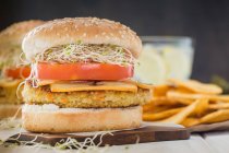 Vegan burger with quinoa, tomato and sprouts — Stock Photo
