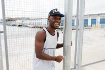 Black man posing on sports ground — Stock Photo