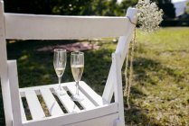 Chair with wineglasses — Stock Photo