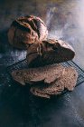 Rustic bread on dark — Stock Photo