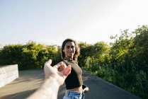 Girl holding male hand — Stock Photo