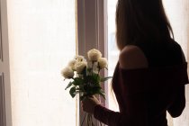 Female holding roses — Stock Photo