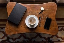 From above shot of coffee and gadgets — Stock Photo