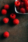 Raspberries on grunge — Stock Photo