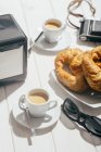 Espresso coffee cups and croissants — Stock Photo