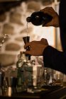 Barman preparing cocktails in pub — Stock Photo