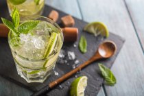 Mojito in glass on wooden table — Stock Photo