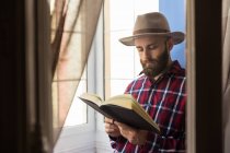 Stylish man reading book — Stock Photo