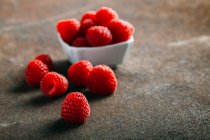 Fresh raspberries on grunge — Stock Photo