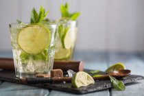 Mojito in glass on wooden table — Stock Photo