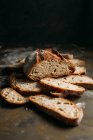 Rustic bread loaf on dark — Stock Photo