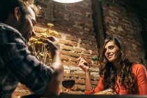 Young Couple Dining in Rustic Apartment — Stock Photo