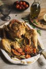 Roasted chicken served in the table — Stock Photo