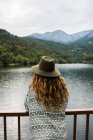 Back view of hipster on landscape — Stock Photo