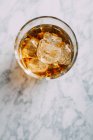 Glass of whiskey with ice — Stock Photo