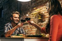 Young Couple Dining in Rustic Apartment — Stock Photo