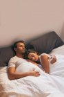 Young Couple Sleeping in Bed — Stock Photo