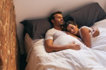 Young Couple Sleeping in Bed — Stock Photo