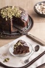 Piece of chocolate cake with ganache — Stock Photo