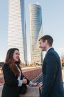 Side view of cheerful business couple at downtown — Stock Photo