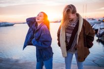 Cute couple of women at sunset — Stock Photo