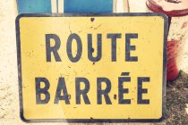 Close up view of road sign plate with route barree inscription — Stock Photo