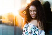 Black woman in sunset lights — Stock Photo