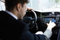 Man using navigator in car — Stock Photo