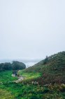 Footpath with walking hikers — Stock Photo
