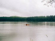 Forest river with sailing kayak — Stock Photo