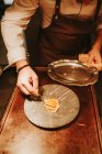 Cheffs hands buttering plate — Stock Photo