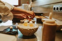 Cook decorating dessert — Stock Photo