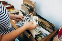 Person holding vintage photos — Stock Photo