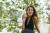 Cheerful traveler with ice cream cone — Stock Photo