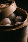 Homemade dumplings in bamboo steamer — Stock Photo